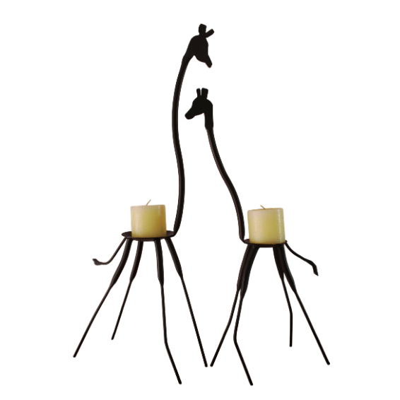 Two black metal giraffe candle holders with candles on a white background