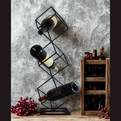 Black metal wine rack with bottles against a textured wall.
