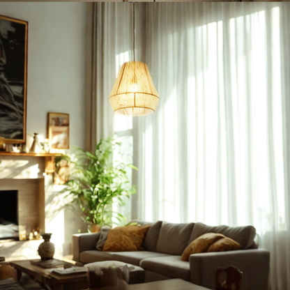 A warm, modern living room scene featuring a woven natural-fiber pendant light hanging over a gray sofa with yellow pillows, set against a background of sheer white curtains and a fireplace.