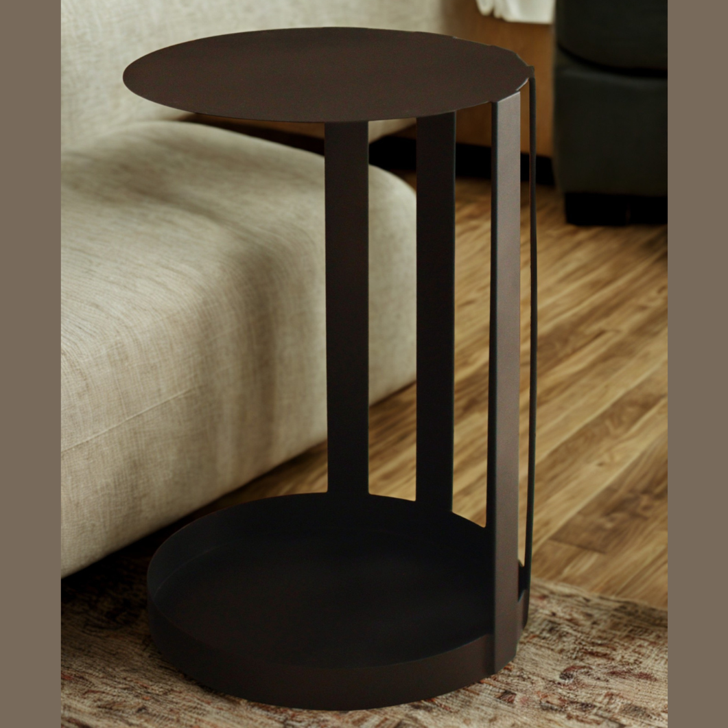 Black metal side table in a living room setting