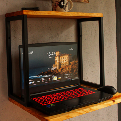 A wall mounted compact work station with laptop and mouse