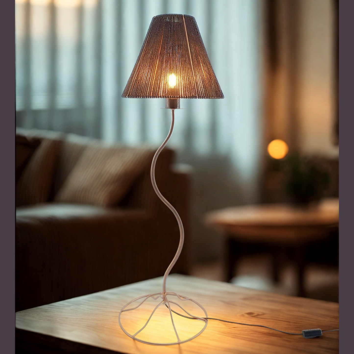 Bespoke table lamp with black cotton twine shade on a wooden table in a lounge