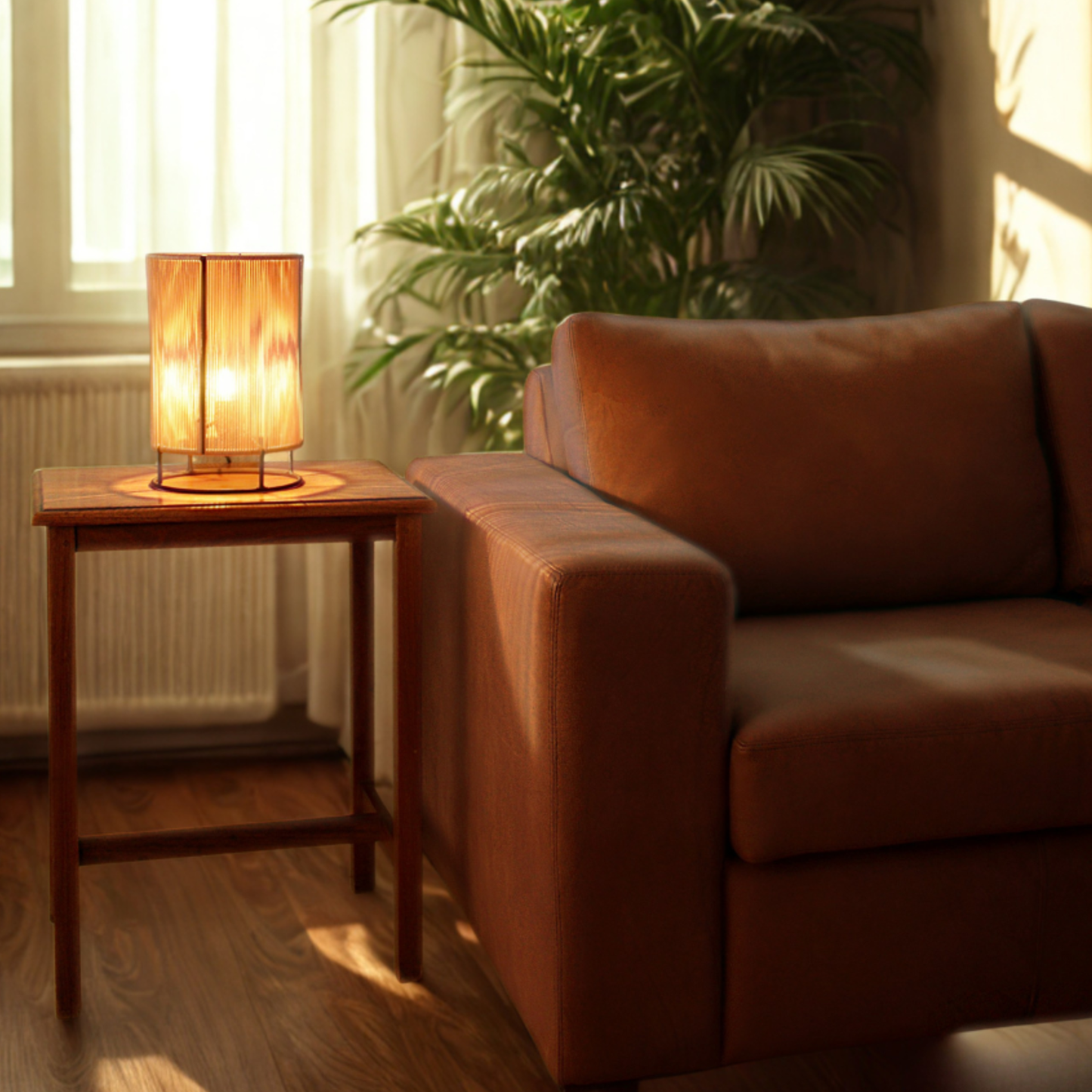 Brown sofa in a room with a wooden side table and a lamp.